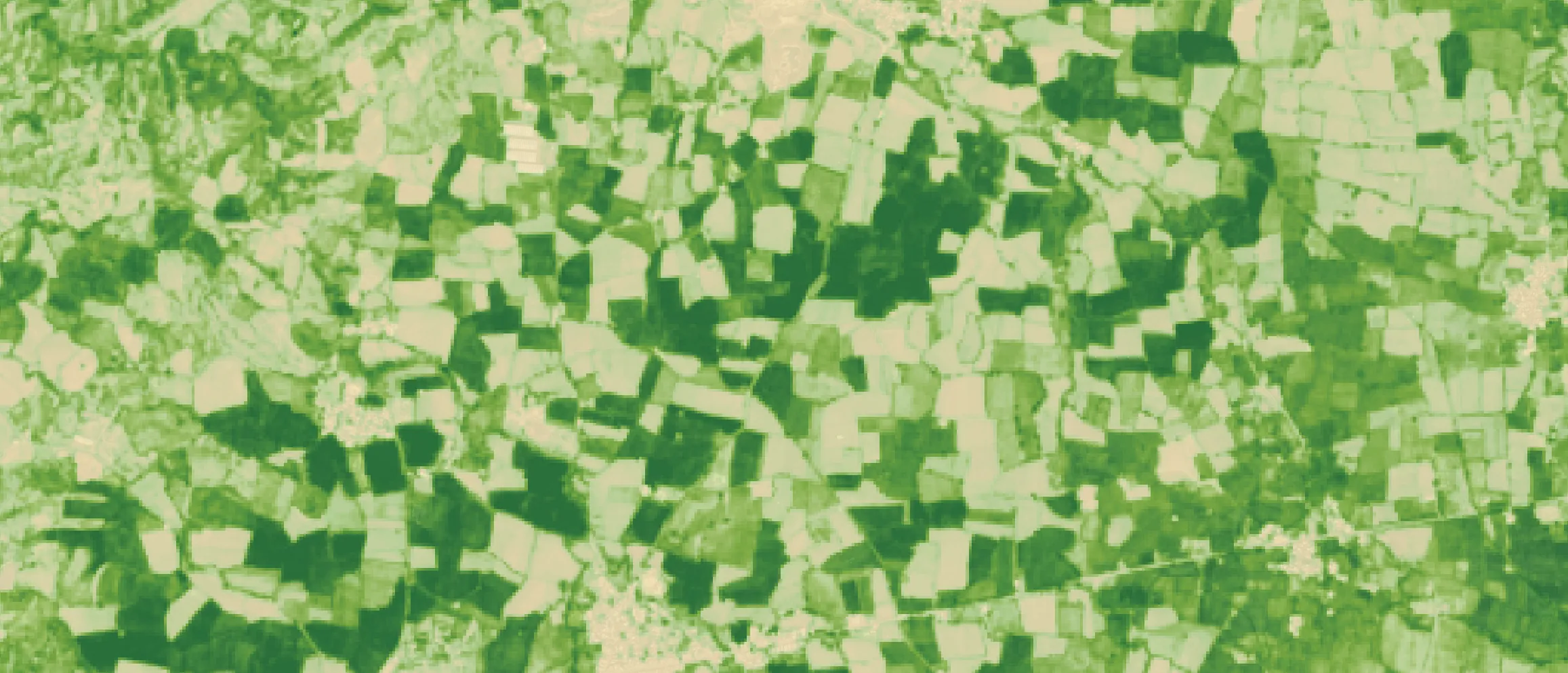 AI crop-health map of the same farmland, healthy fields in dark green